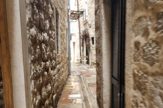 Food, wine and the best private walking tour of Kotor - Stop 2: Kotor Farmers Market for prosciutto, cheese, olives, and rakija
