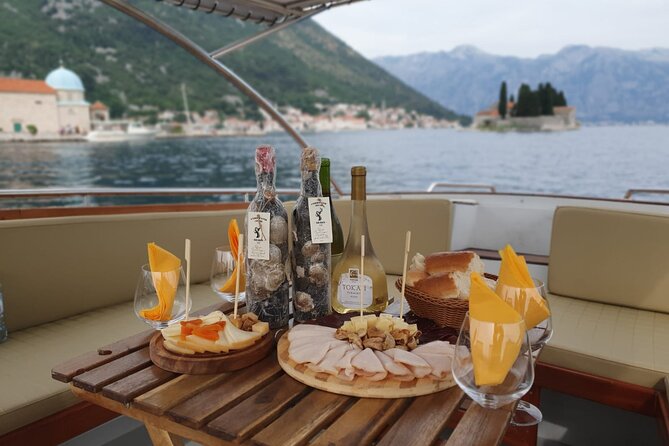 Kotor Sightseeing Exclusive 4-Hour Private Boat Tour up to 12 ppl - Hidden submarine tunnel: a wartime shelter seen from the bay